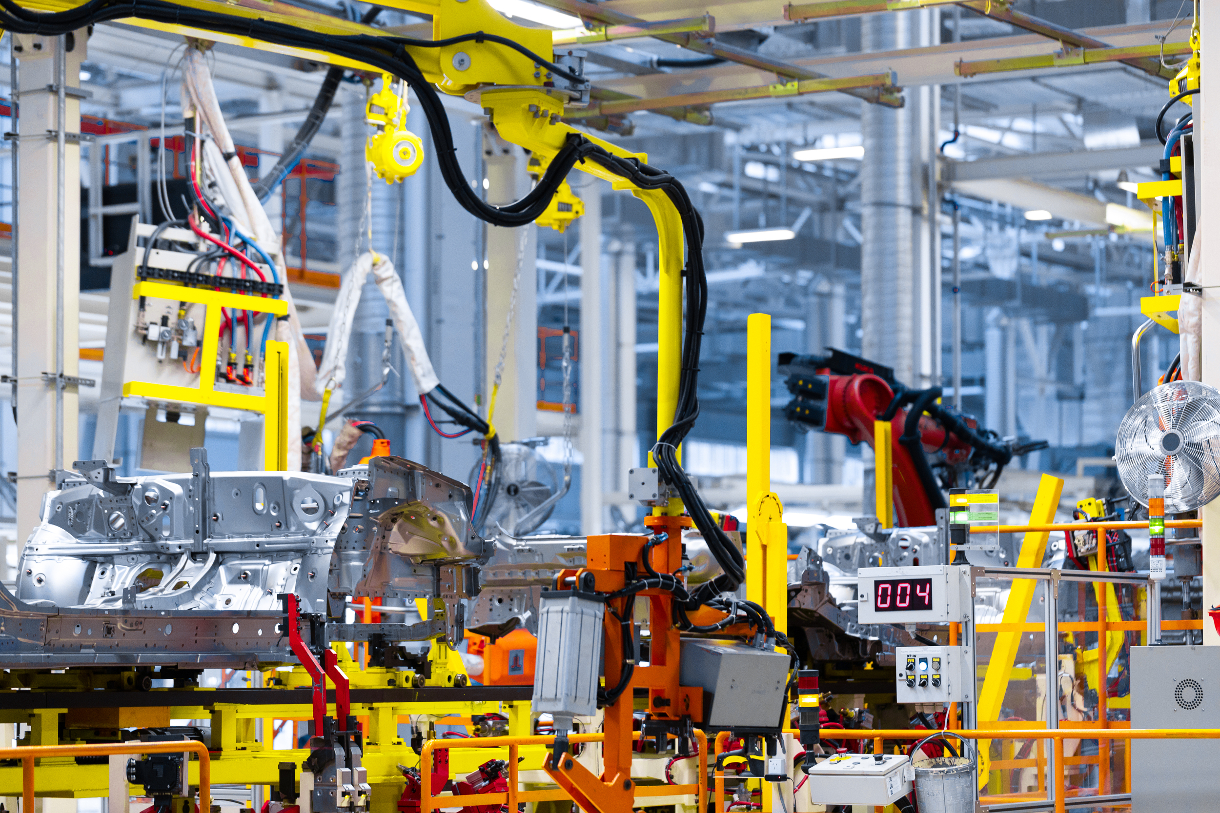 modern automated assembly line for cars. latest technological neutral technologies of production of cars at plant. Assembly shop for modern cars
